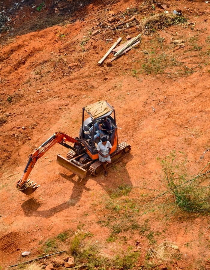 Home Industrial excavator digging on a construction site, highlighting earth-moving operations.